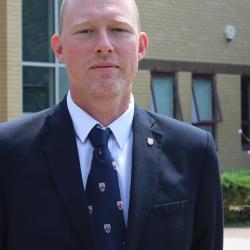Martin Vinnell standing in front of a building