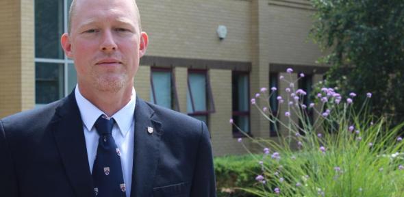 Martin Vinnell standing in front of a building