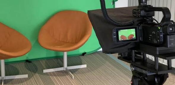 Green screen, brown chairs and video camera Green screen video camera