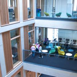 A picture taken within the student services centre, showing two different floors.